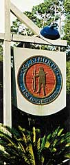 sign hanging from post